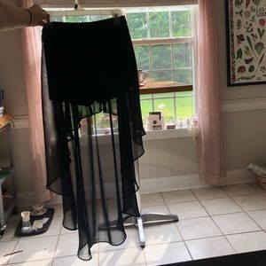 Black shorts with back sheer low high over skirt
